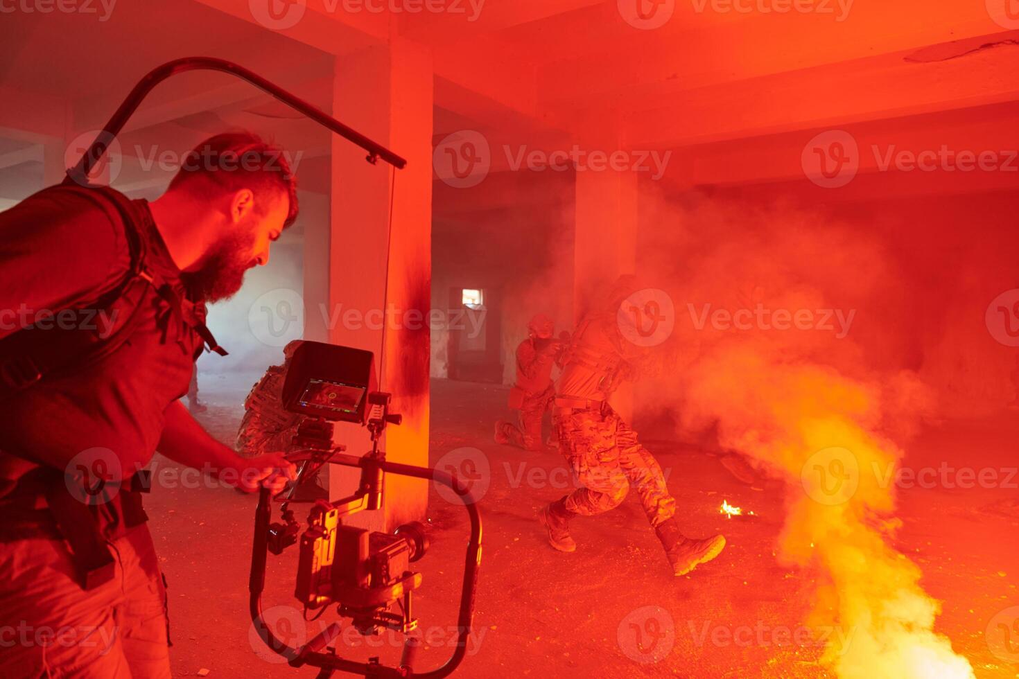A professional cameraman captures the intense moments as a group of skilled soldiers embarks on a dangerous mission inside an abandoned building, their actions filled with suspense and bravery photo