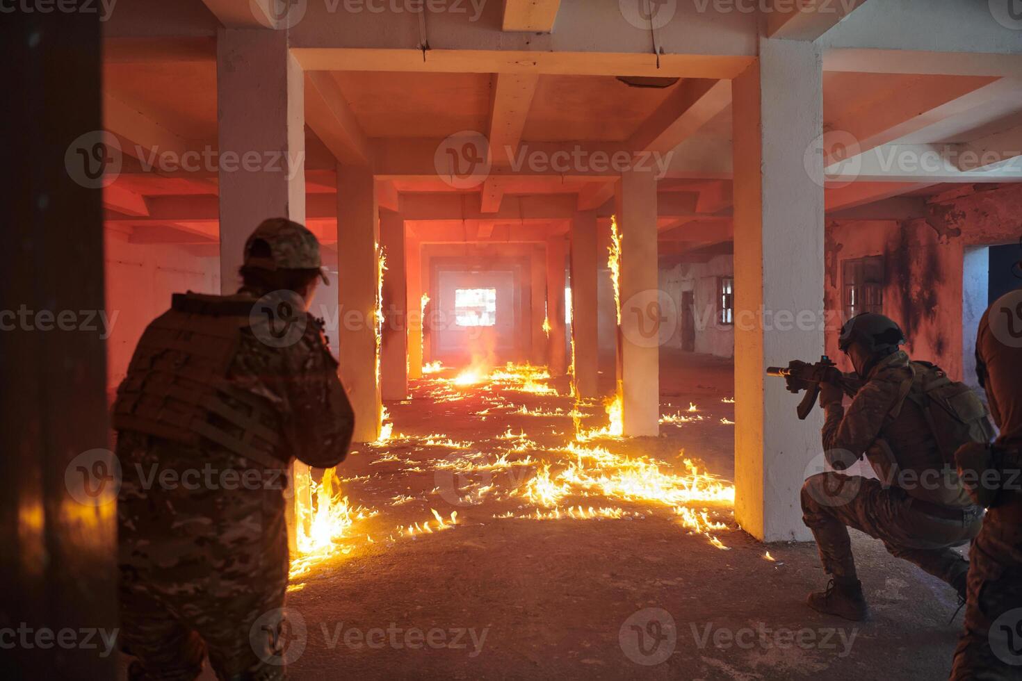 A group of professional soldiers bravely executes a dangerous rescue mission, surrounded by fire in a perilous building. photo