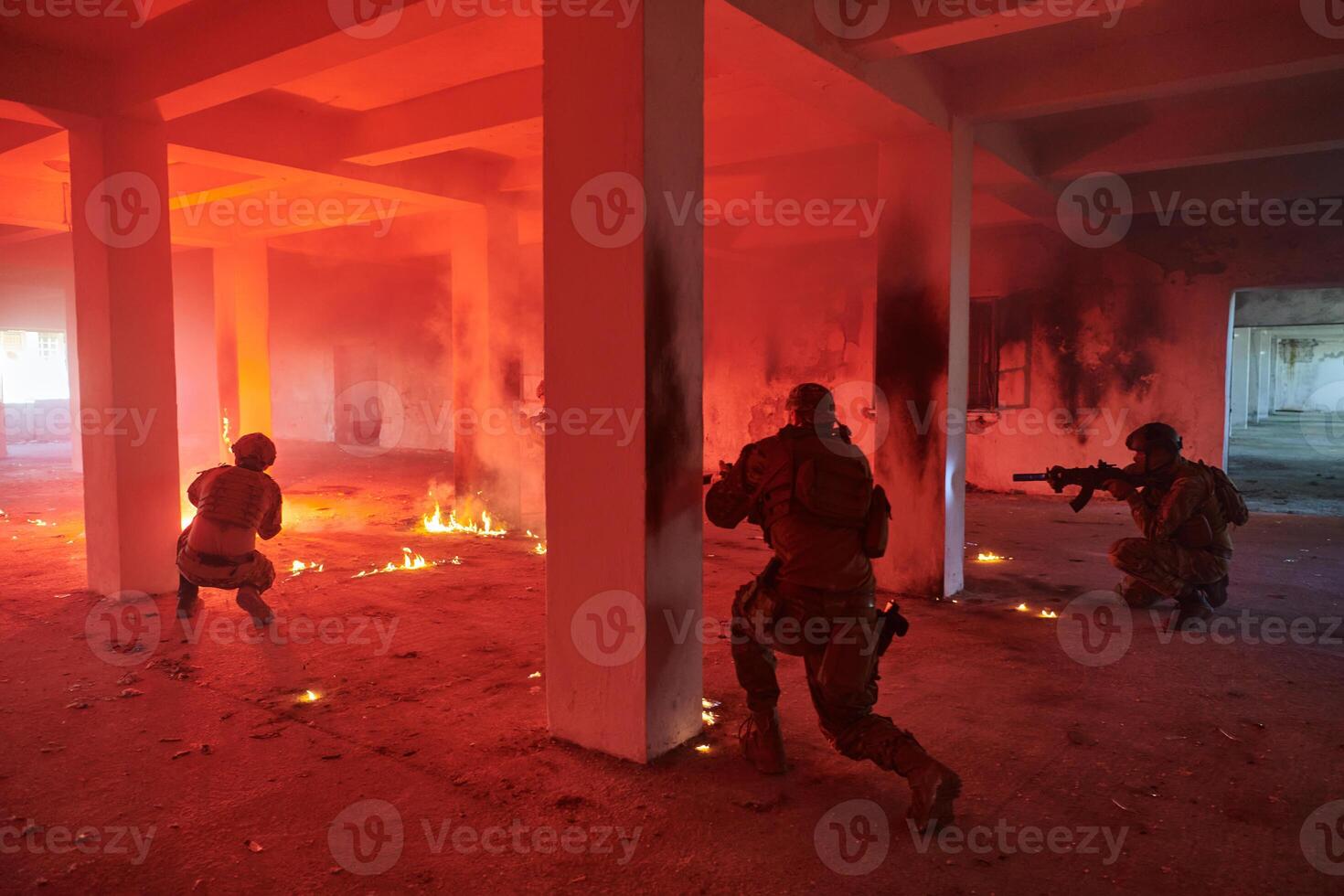 A group of professional soldiers bravely executes a dangerous rescue mission, surrounded by fire in a perilous building. photo
