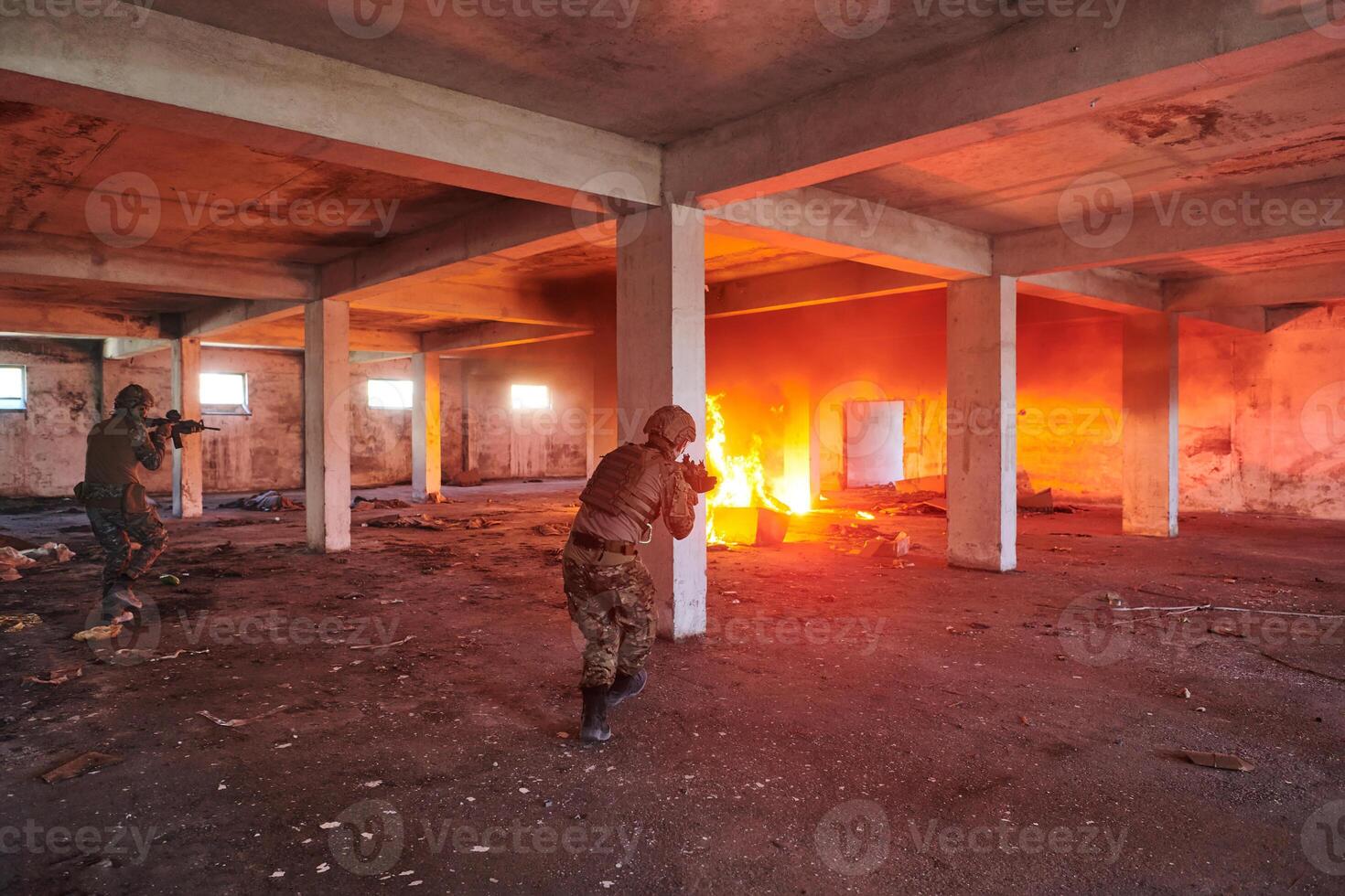 A group of professional soldiers bravely executes a dangerous rescue mission, surrounded by fire in a perilous building. photo