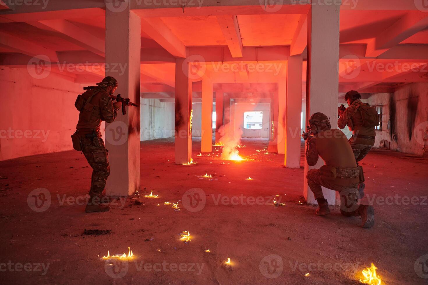 A group of professional soldiers bravely executes a dangerous rescue mission, surrounded by fire in a perilous building. photo