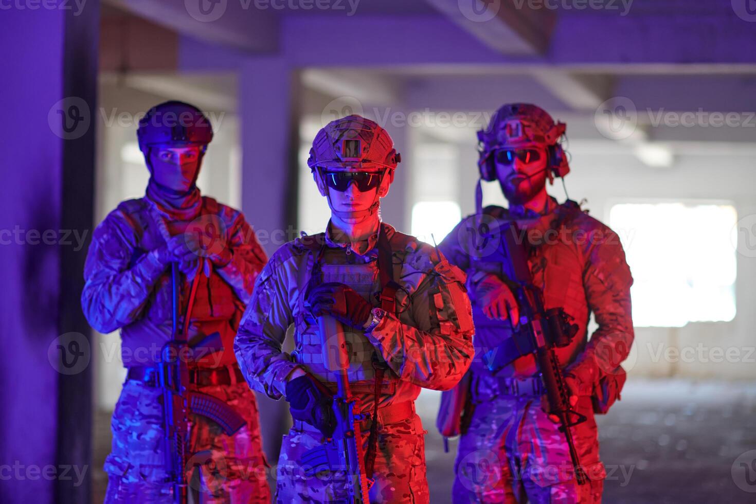 Soldier squad team walking in urban environment colored lightis photo