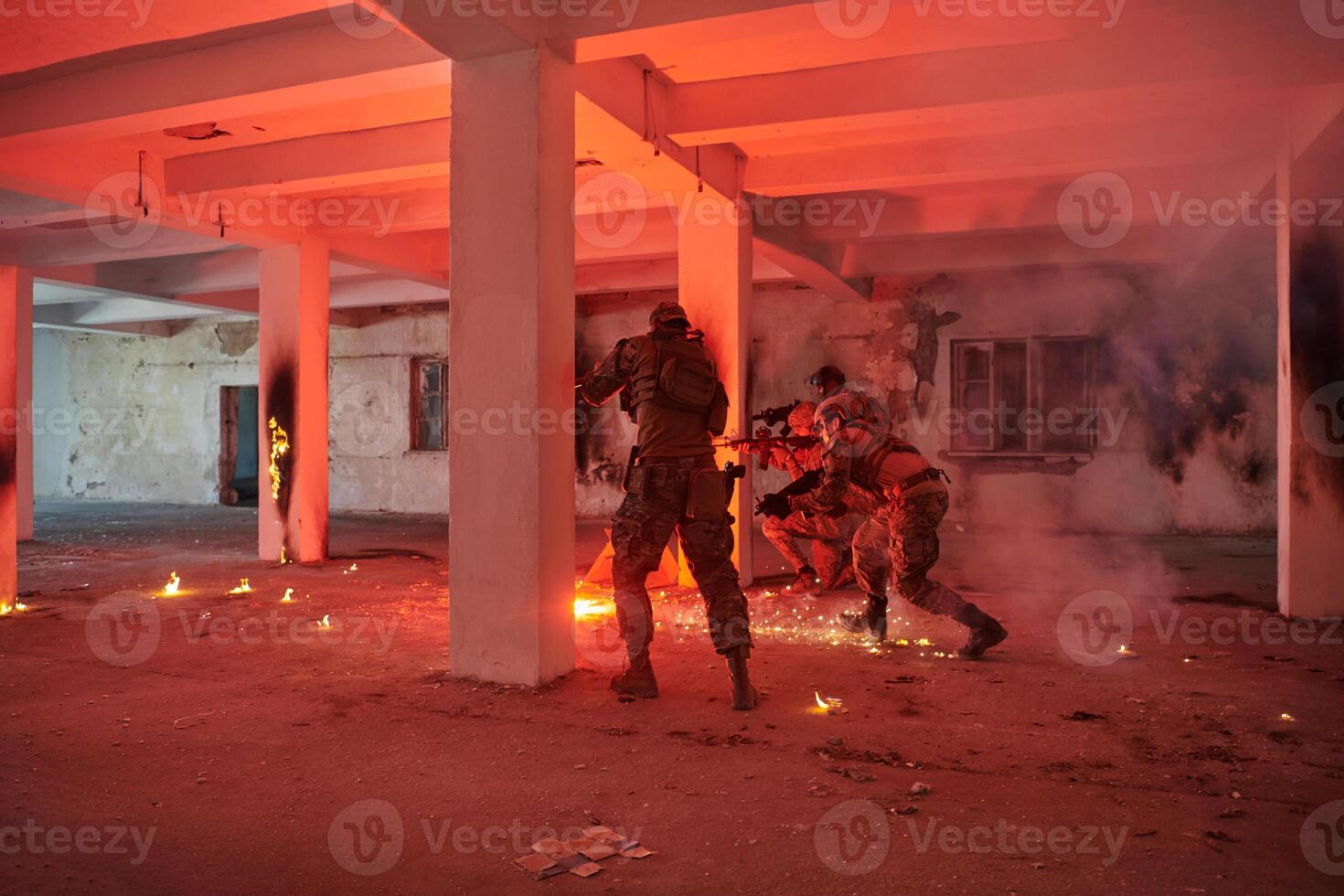 A group of professional soldiers bravely executes a dangerous rescue mission, surrounded by fire in a perilous building. photo
