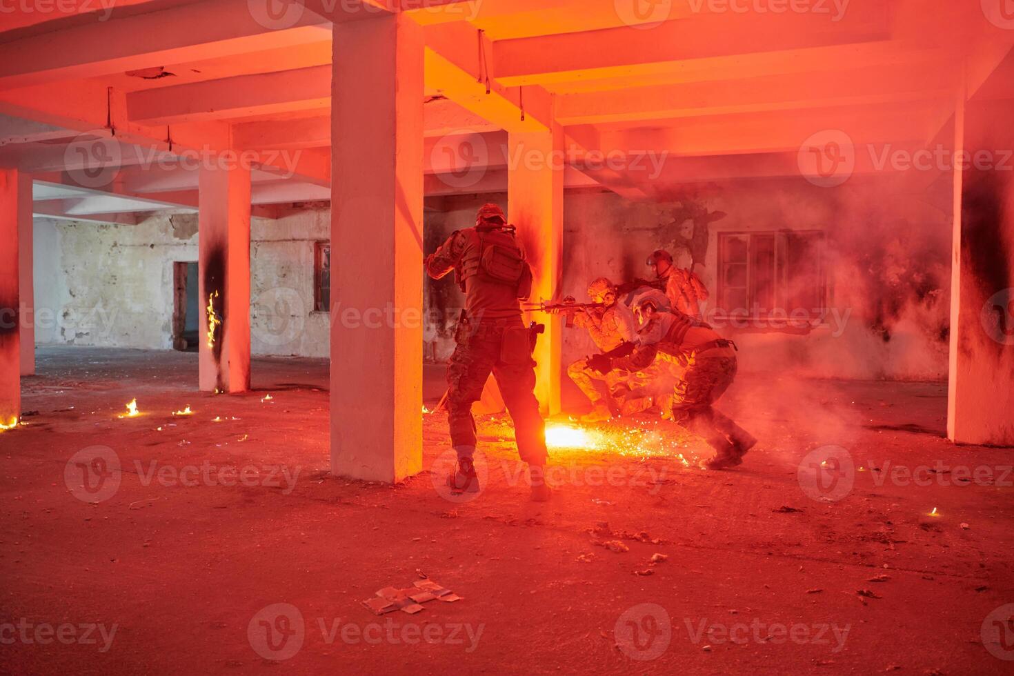 A group of professional soldiers bravely executes a dangerous rescue mission, surrounded by fire in a perilous building. photo