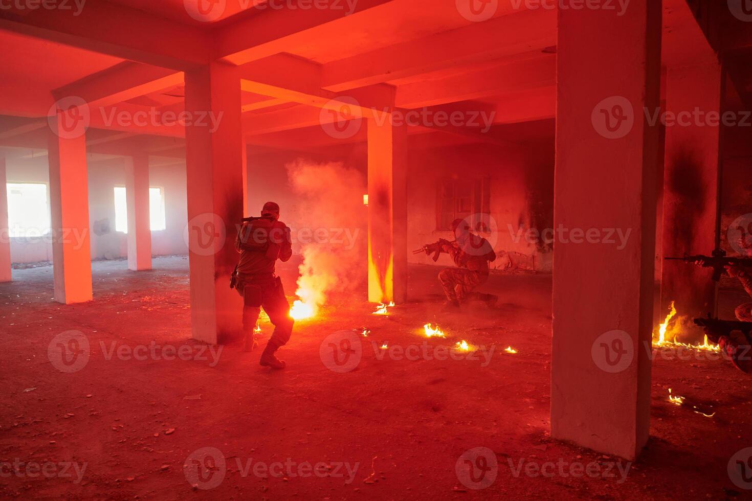 A group of professional soldiers bravely executes a dangerous rescue mission, surrounded by fire in a perilous building. photo