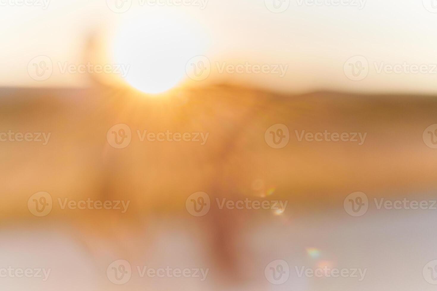 The mesmerizing beauty of a hazy sunrise, as the early morning mist diffuses the golden rays of light, creating an ethereal and enchanting landscape that evokes a sense of tranquility and serenity. photo