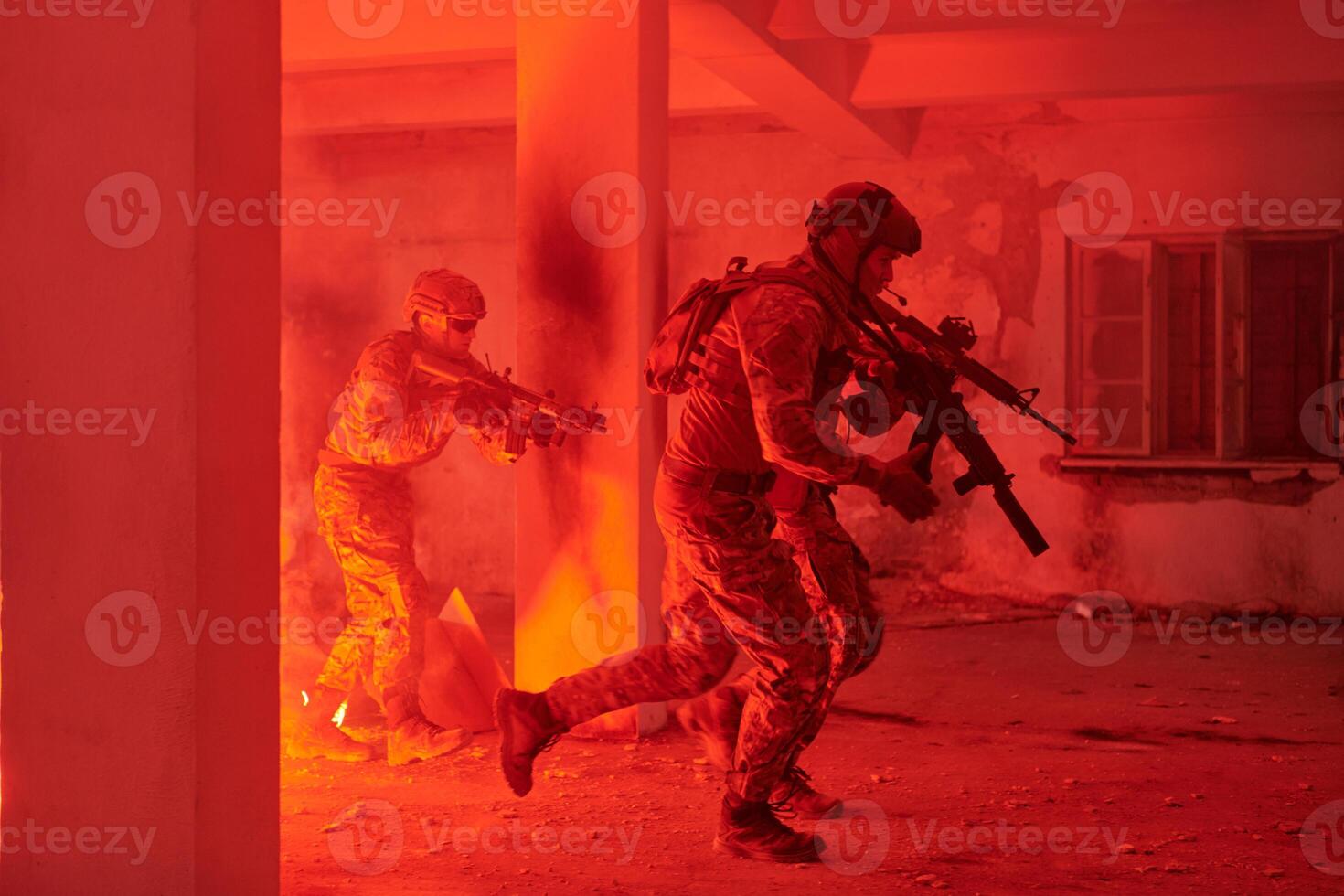 A group of professional soldiers bravely executes a dangerous rescue mission, surrounded by fire in a perilous building. photo