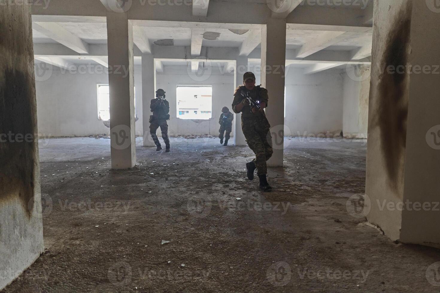 A professional cameraman captures the intense moments as a group of skilled soldiers embarks on a dangerous mission inside an abandoned building, their actions filled with suspense and bravery photo