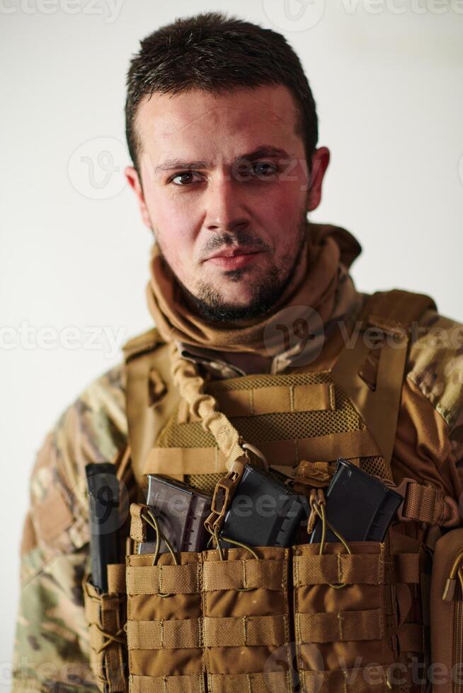 Modern warfare soldier portrait in urban environment photo