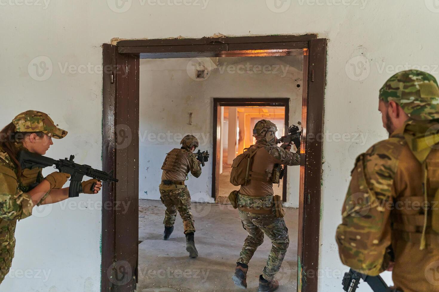 A group of professional soldiers bravely executes a dangerous rescue mission, surrounded by fire in a perilous building. photo