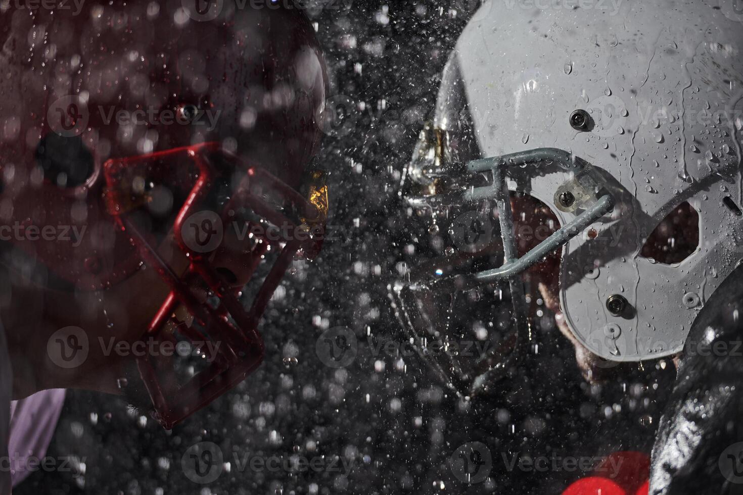 Two american football players face to face in silhouette shadow on white background photo