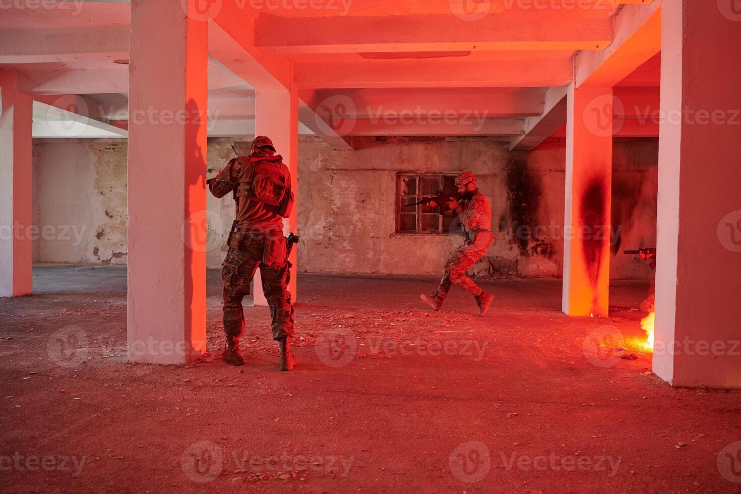 A group of professional soldiers bravely executes a dangerous rescue mission, surrounded by fire in a perilous building. photo