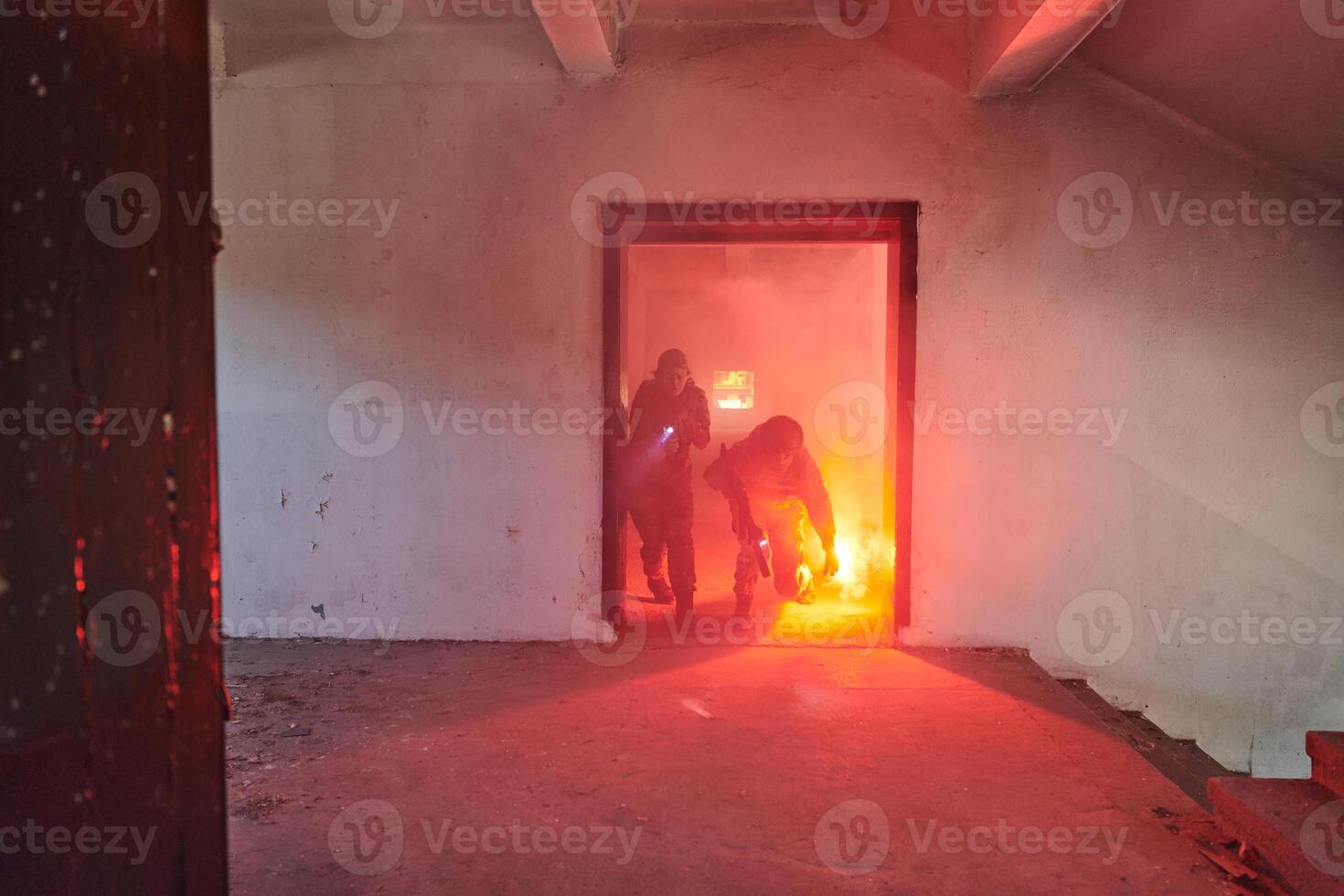 A group of professional soldiers bravely executes a dangerous rescue mission, surrounded by fire in a perilous building. photo
