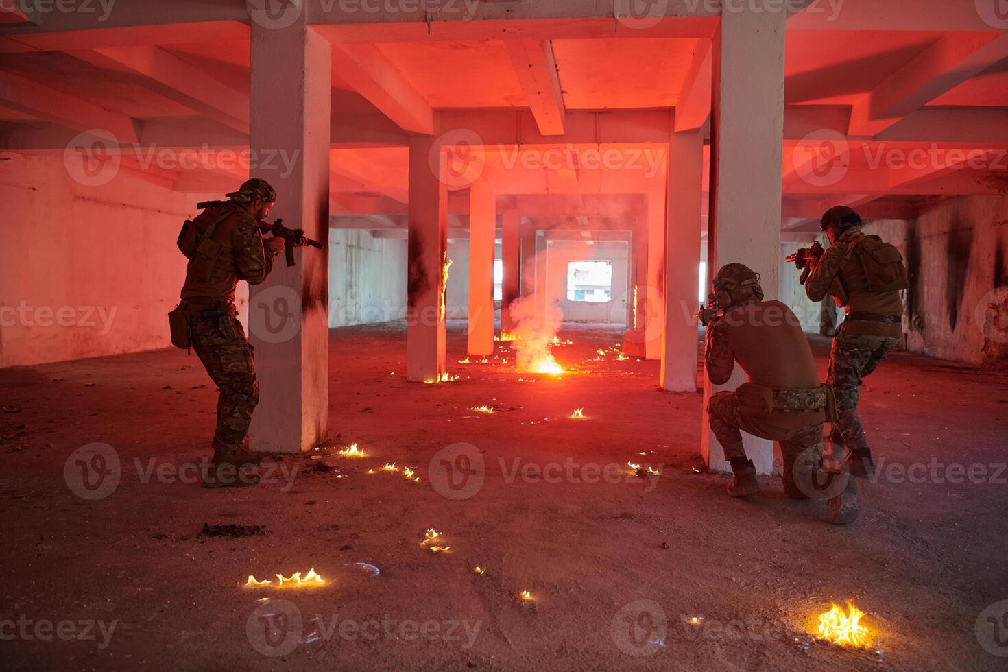 A group of professional soldiers bravely executes a dangerous rescue mission, surrounded by fire in a perilous building. photo