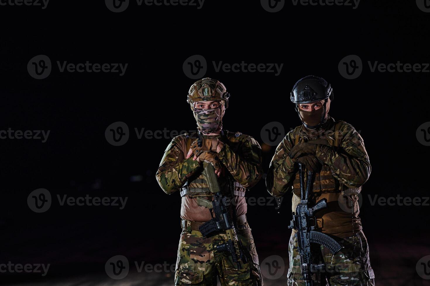 Two professional soldiers marching through the dark of night on a dangerous mission, epitomizing their unwavering bravery, unwavering teamwork, and the high-stakes intensity of their specialized photo