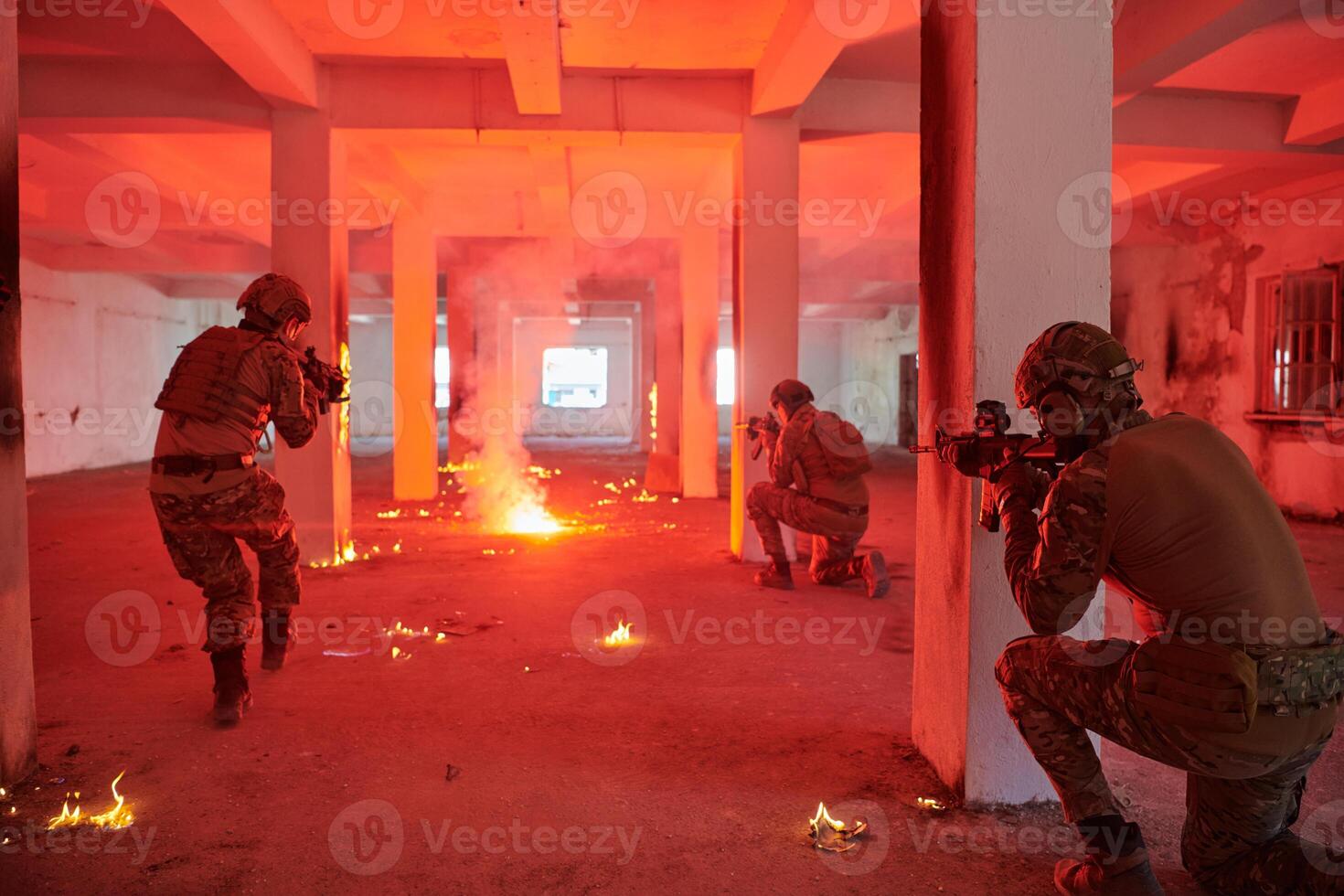 A group of professional soldiers bravely executes a dangerous rescue mission, surrounded by fire in a perilous building. photo