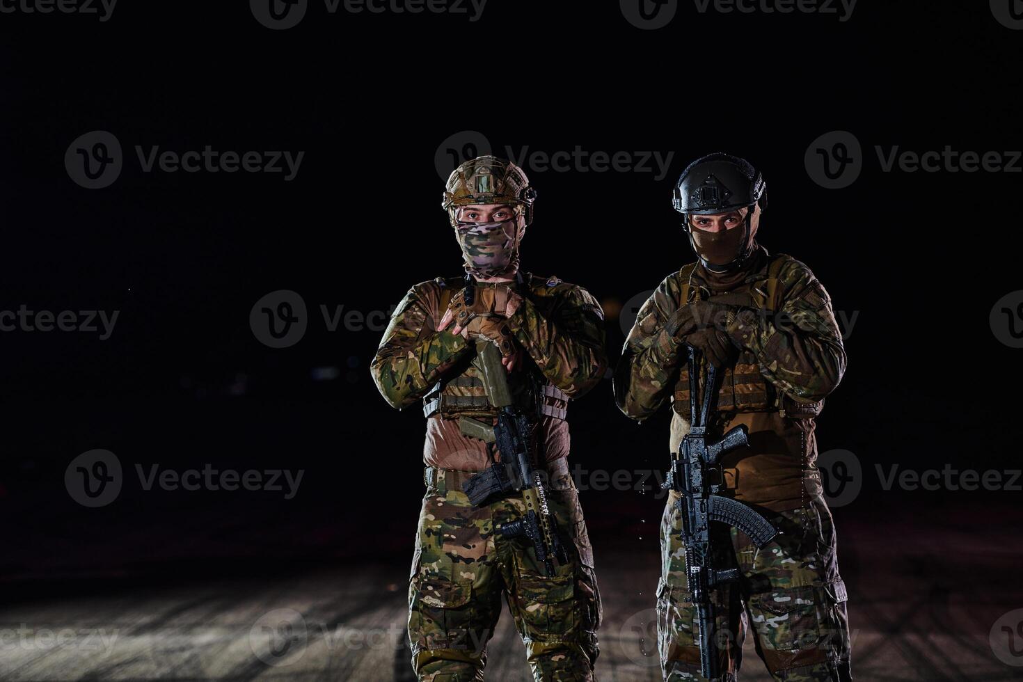 Two professional soldiers marching through the dark of night on a dangerous mission, epitomizing their unwavering bravery, unwavering teamwork, and the high-stakes intensity of their specialized photo