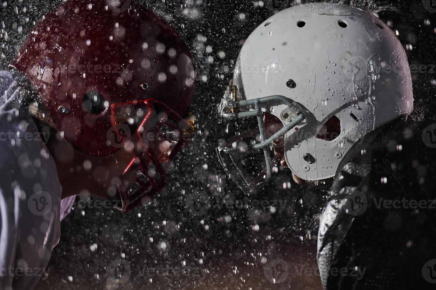 Two american football players face to face in silhouette shadow on white background photo
