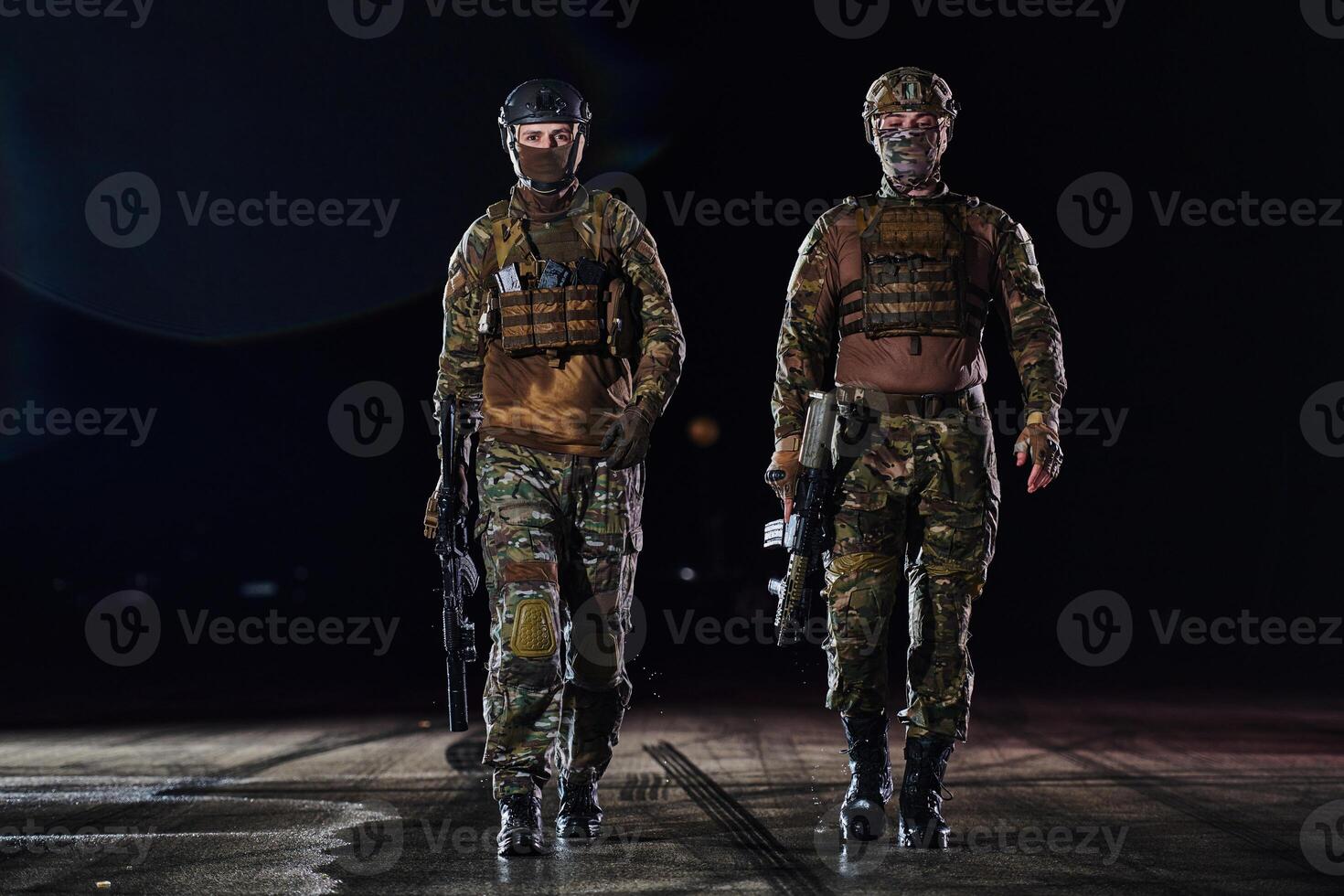 Two professional soldiers marching through the dark of night on a dangerous mission, epitomizing their unwavering bravery, unwavering teamwork, and the high-stakes intensity of their specialized photo