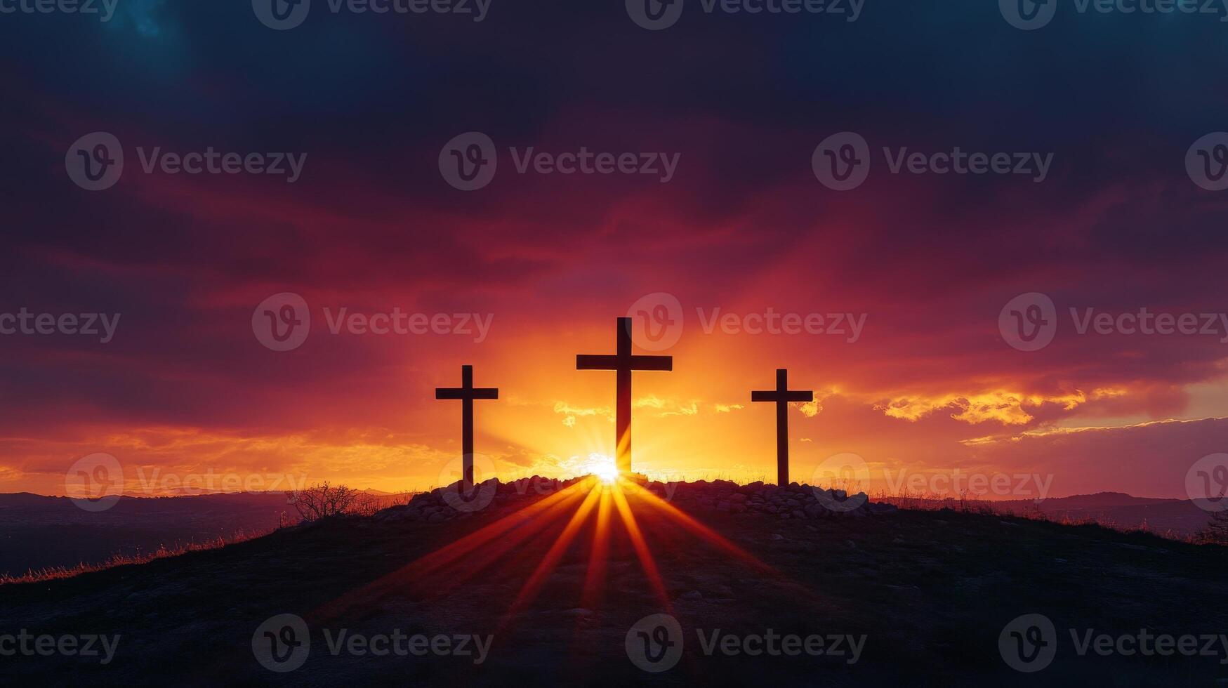 Dramatic sunset behind three crosses on hill silhouette photo