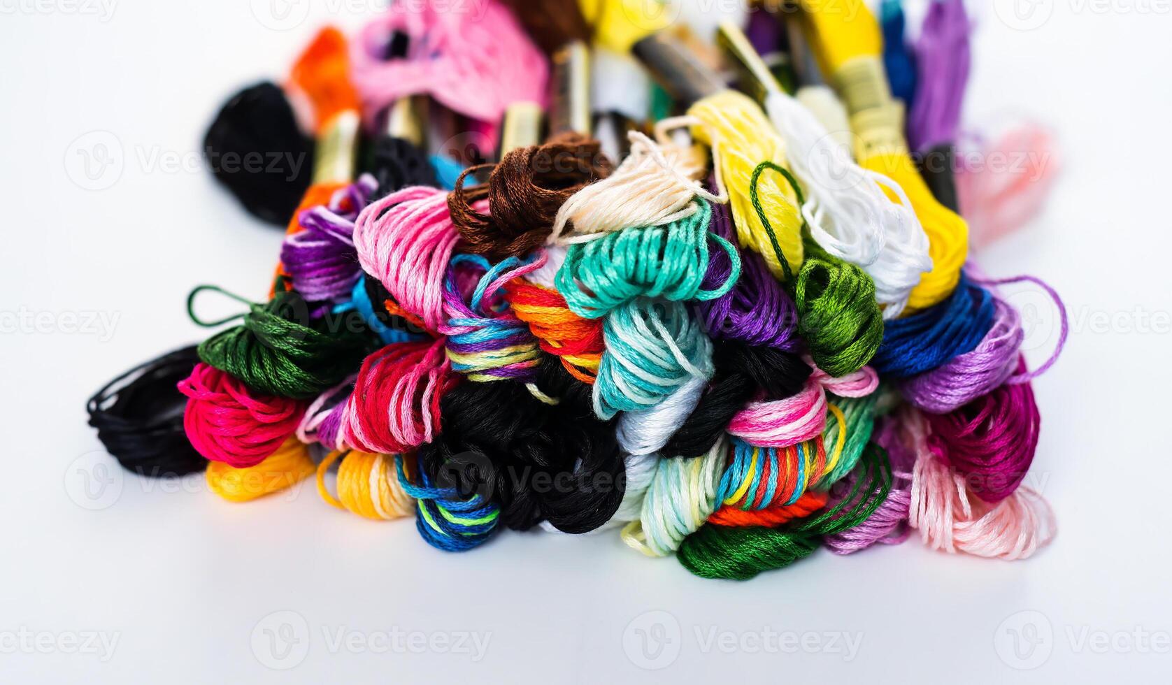 Many skeins of mouline thread for embroidery melange background photo