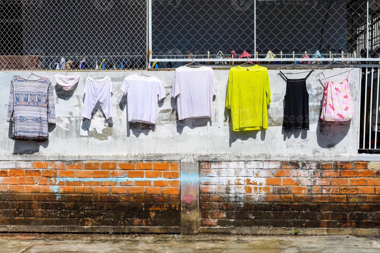 Wet laundry hanging on a rope in rural area in Vietnam photo