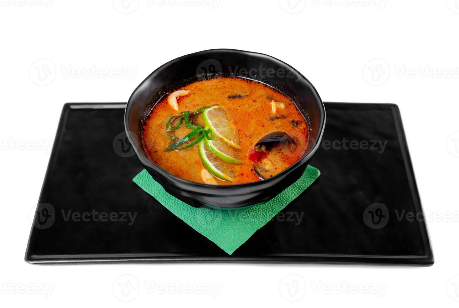 Soup tom yum with seashells and mussels top view on white background photo