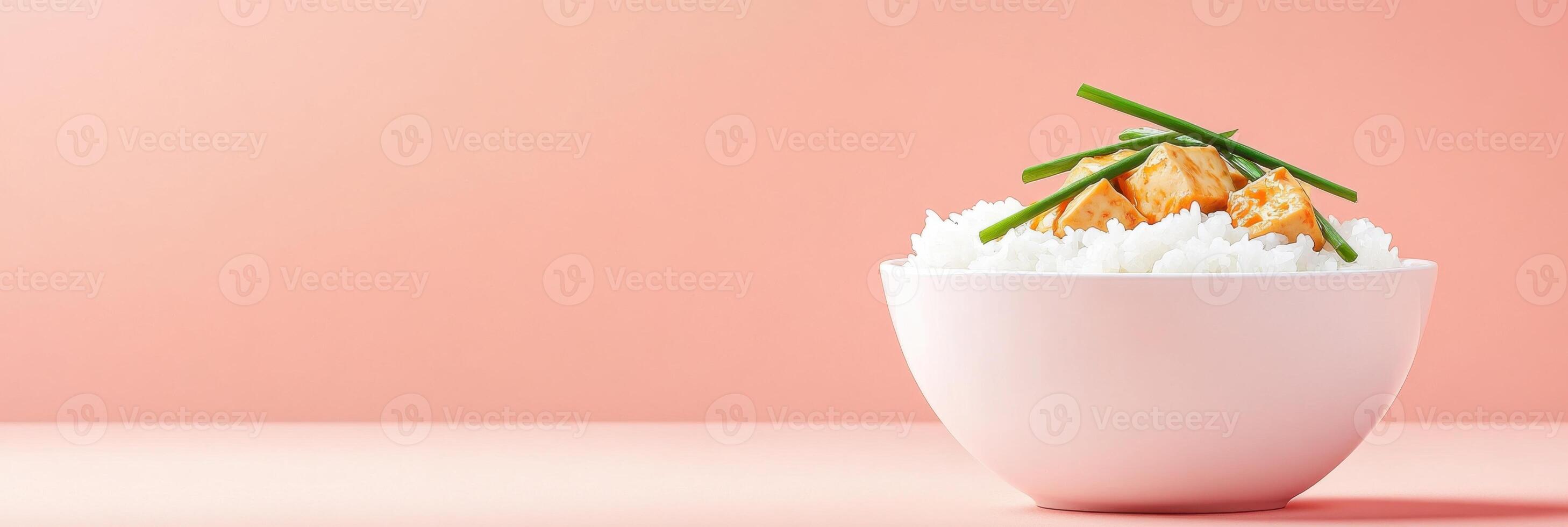 Delicious bowl of mapo tofu served with steamed rice and garnished with fresh green onions photo