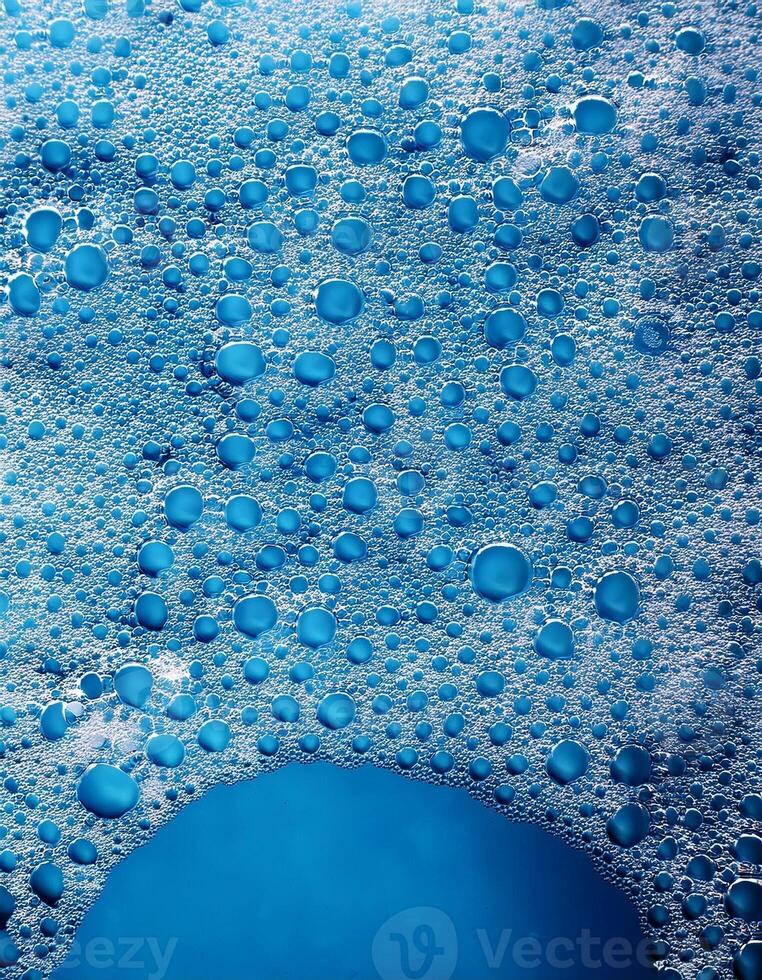 Bubbles Create a Mesmerizing Pattern in Bright Blue Water During a Refreshing Summer Day photo