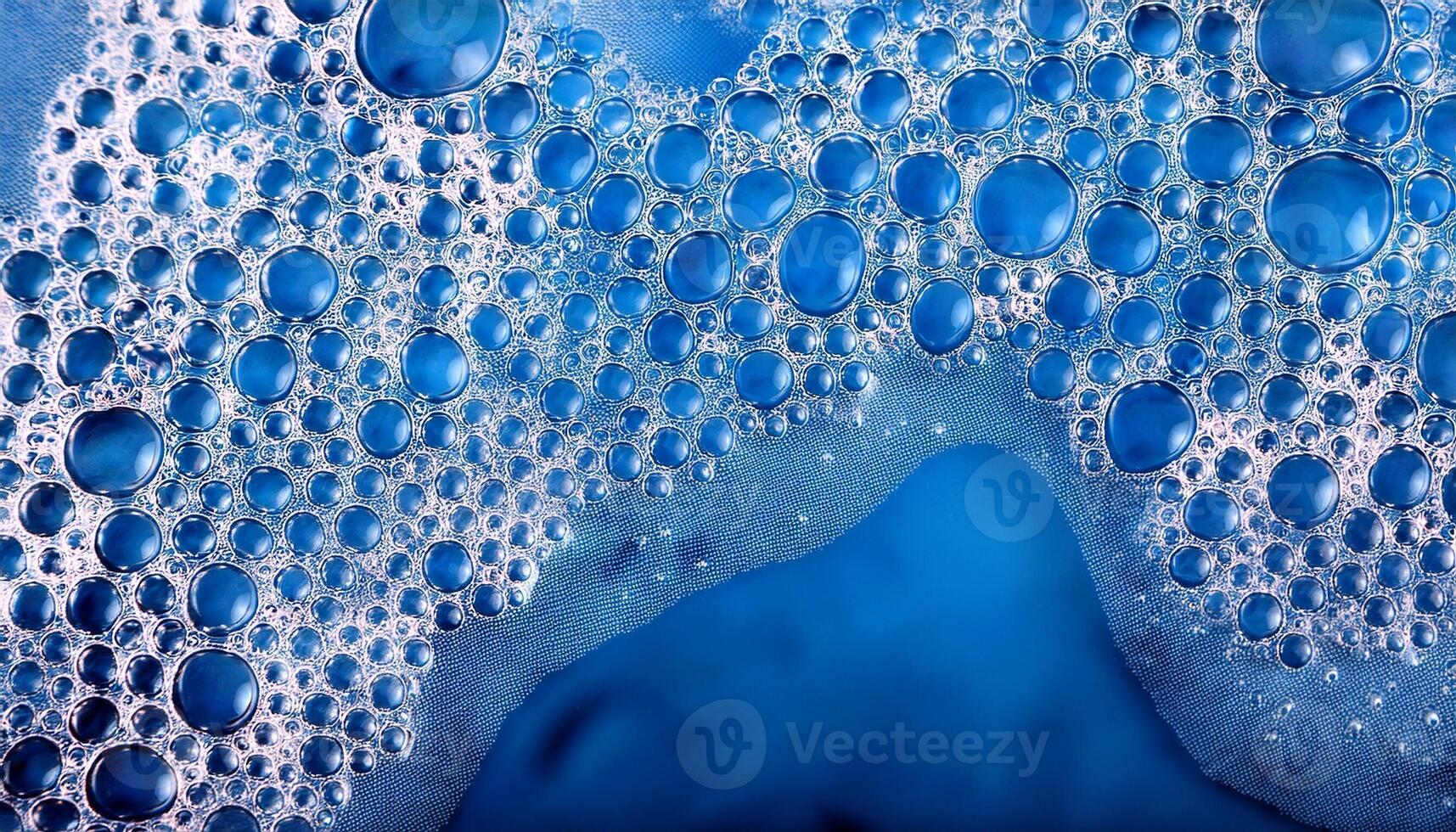 Water Droplets Cluster on a Smooth Surface Creating a Textured and Vibrant Blue Background photo