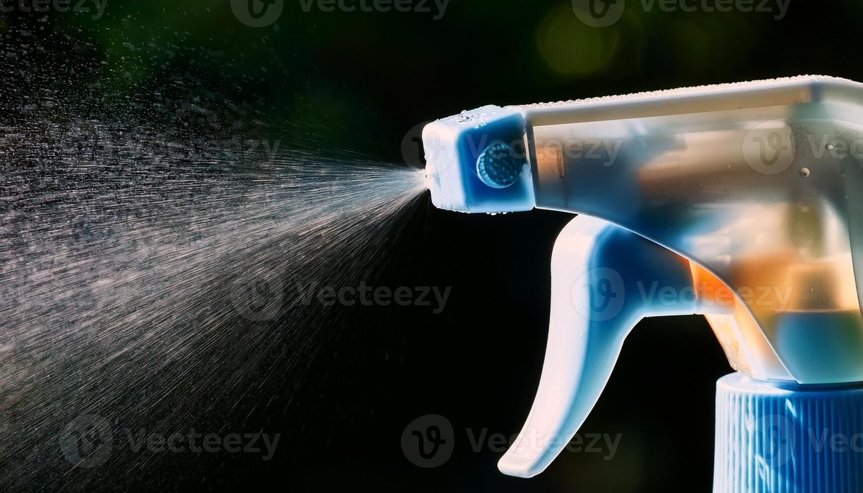 Spray Bottle Releasing a Fine Mist of Liquid in a Vibrant Outdoor Setting During the Day photo