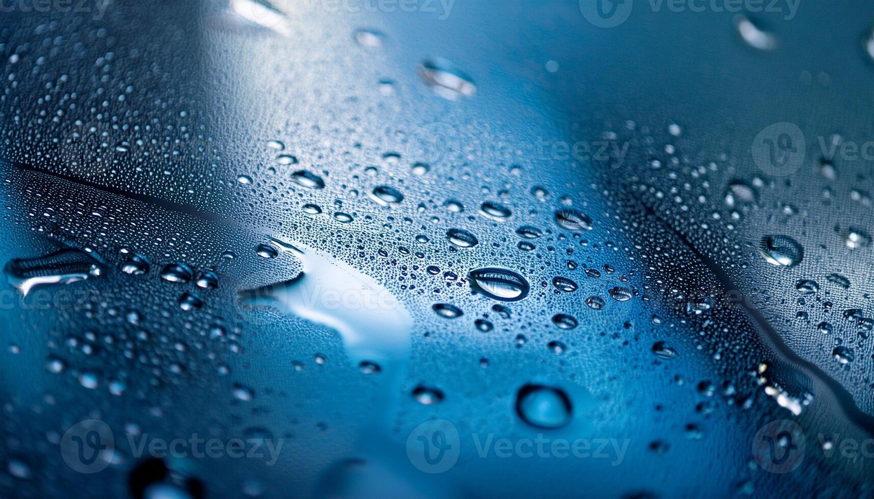 Raindrops Create Beautiful Patterns on a Blue Surface During a Rainy Day photo