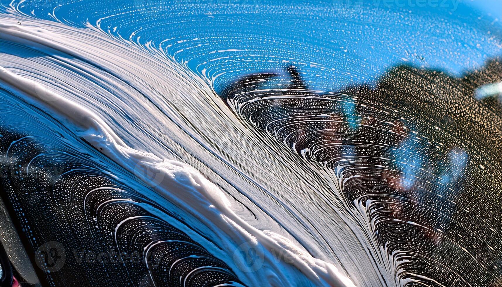 Suds and Shine as Sunlight Glistens on Freshly Washed Car Window in a Vibrant Outdoor Setting photo