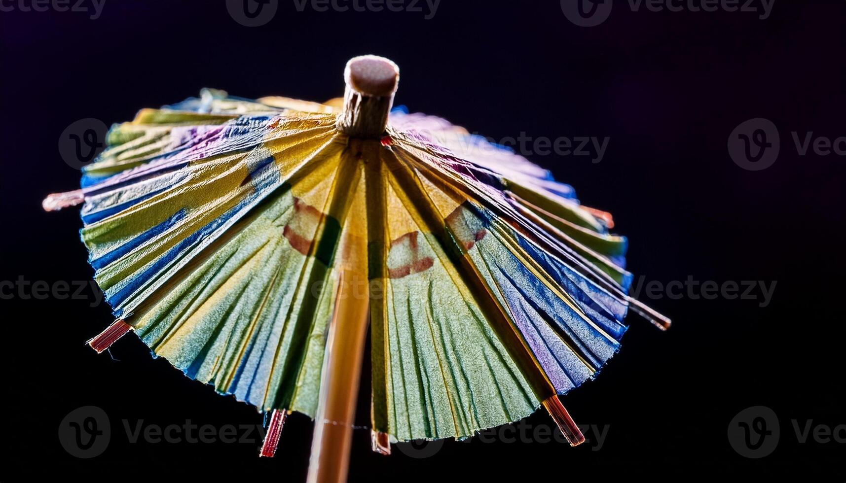Colorful Cocktail Umbrella Stands out Against Dark Background, Perfect for Summer Drinks and Celebrations photo