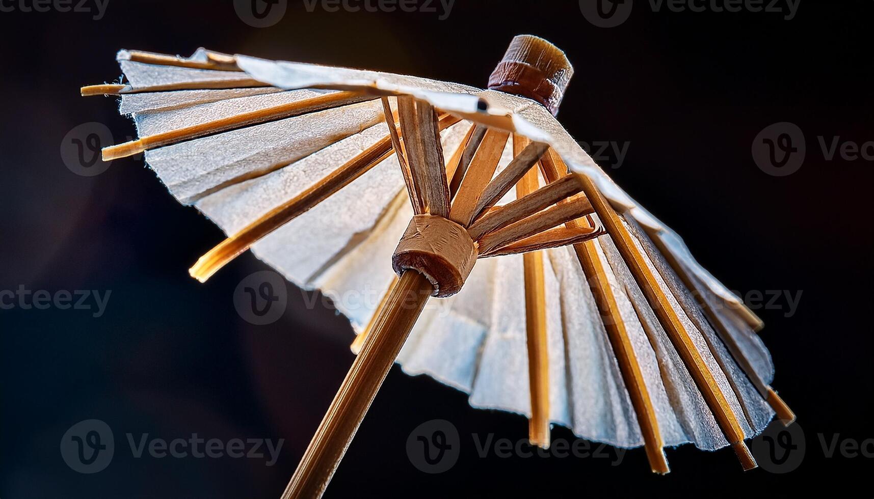 Detailed Close-Up of a Decorative Cocktail Umbrella Showcasing Its Intricate Design and Vibrant Colors During a Summer Gathering photo