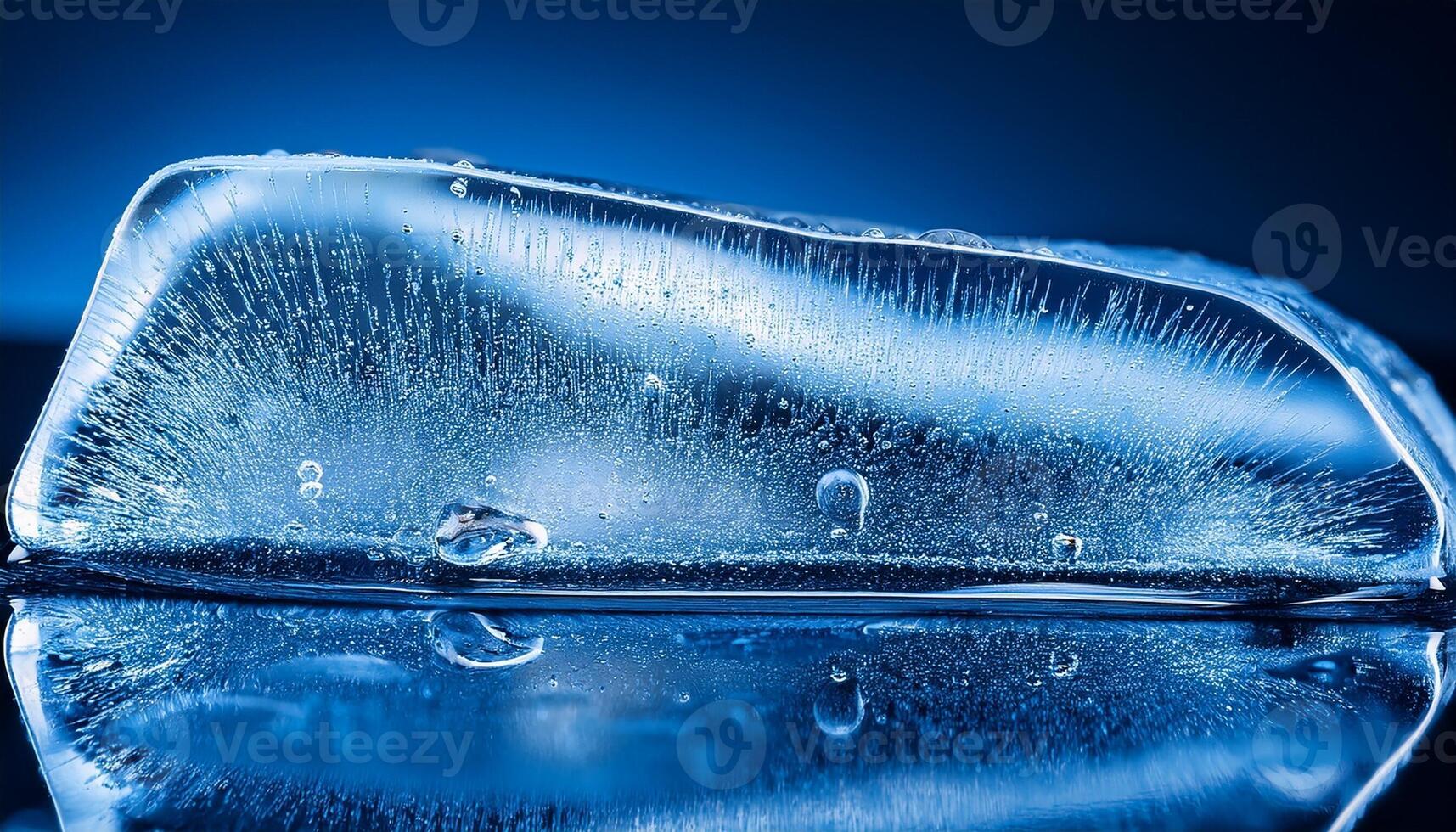 Close-up View of a Crystal-Clear Ice Block on Glossy Surface Reflecting Blue Light in a Cool Setting photo