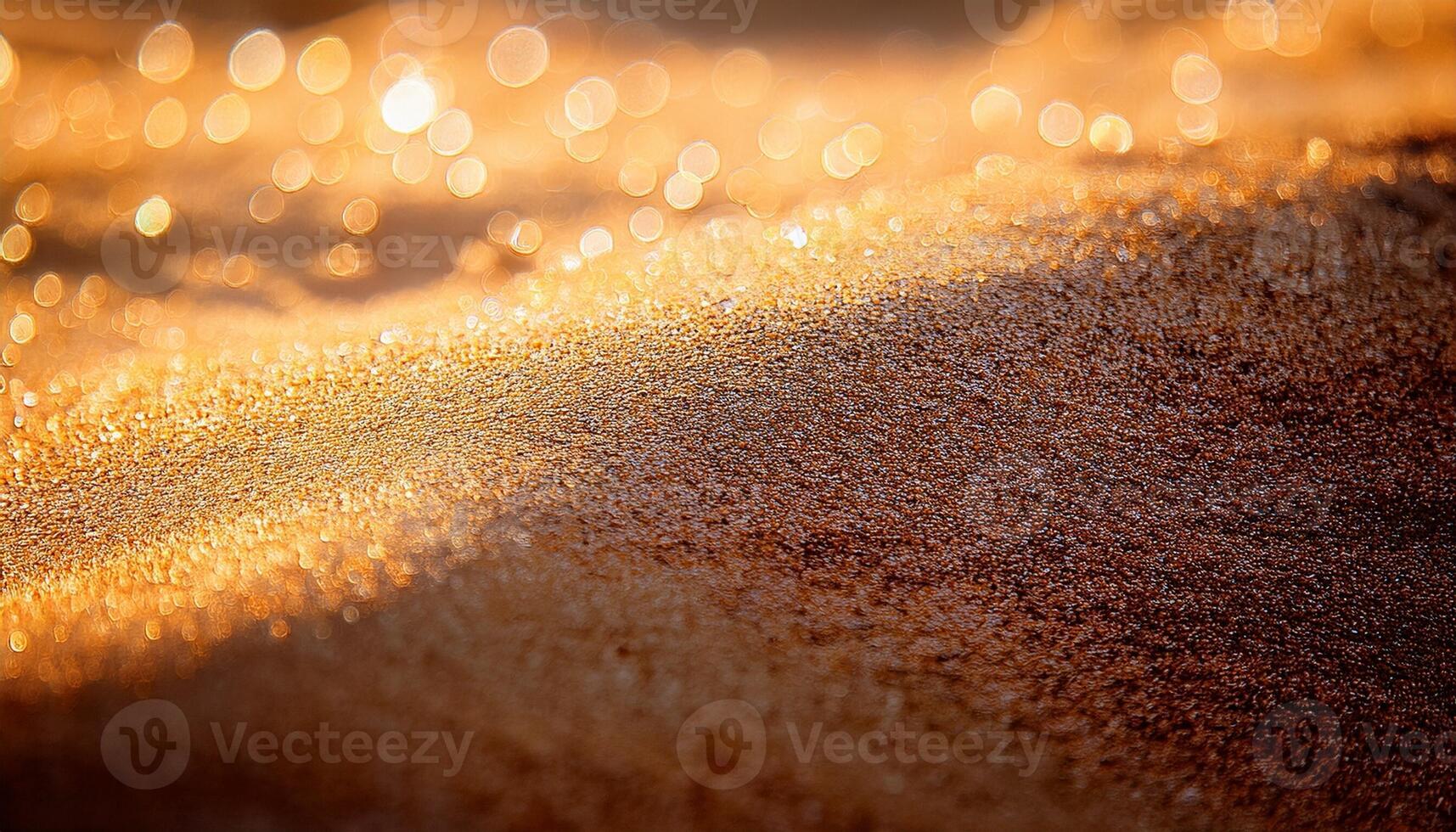 Golden Sand Glimmers Under Warm Sunlight at a Beach in Late Afternoon photo