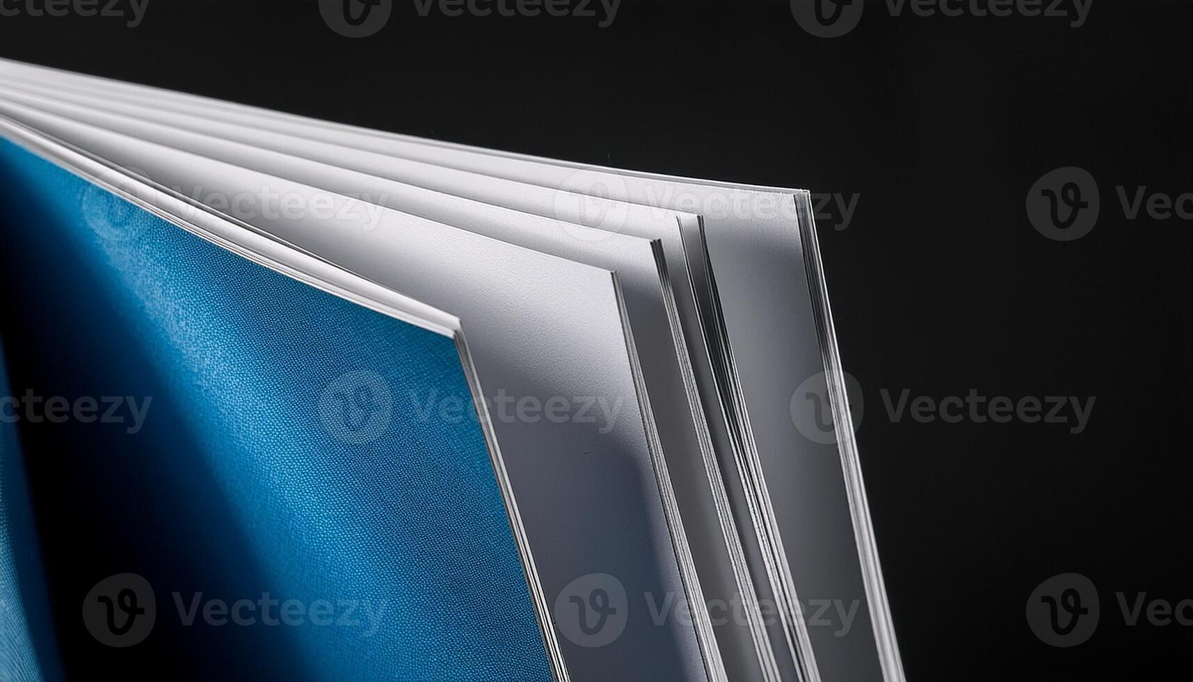 Close-up View of an Open Book Showcasing Its Blank Pages and Colorful Cover photo