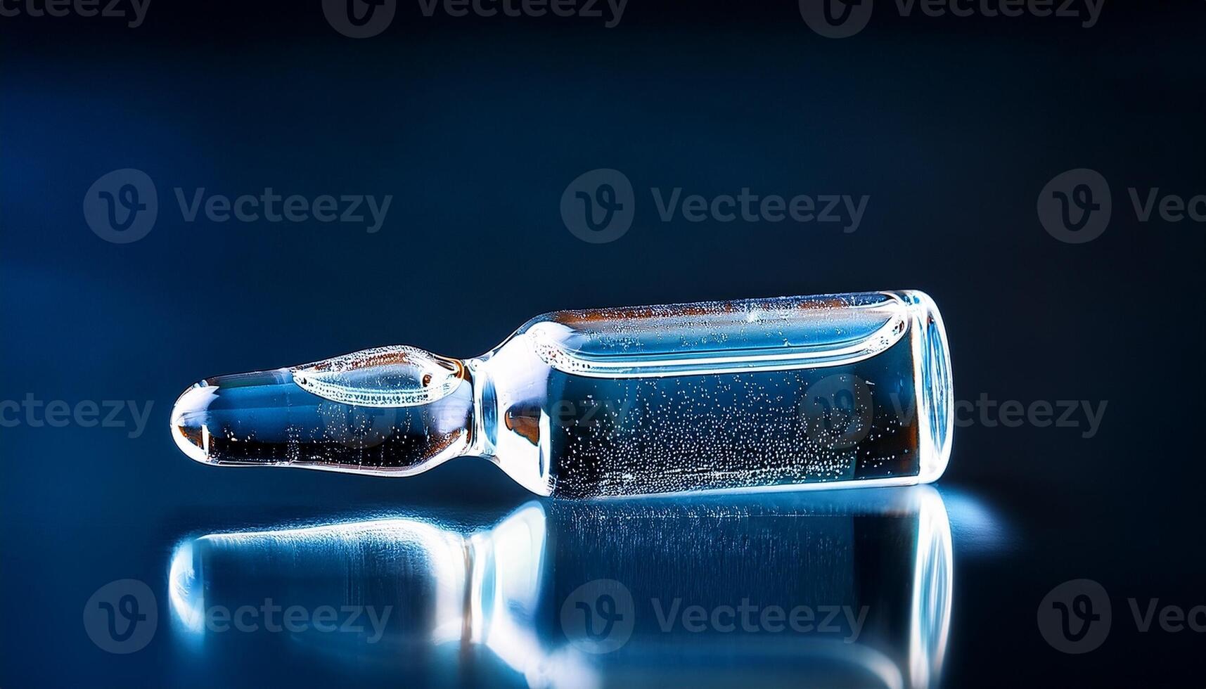 Clear Glass Vial Containing Liquid With Bubbles Reflecting Light on a Dark Background, Showcasing Scientific or Pharmaceutical Elements photo