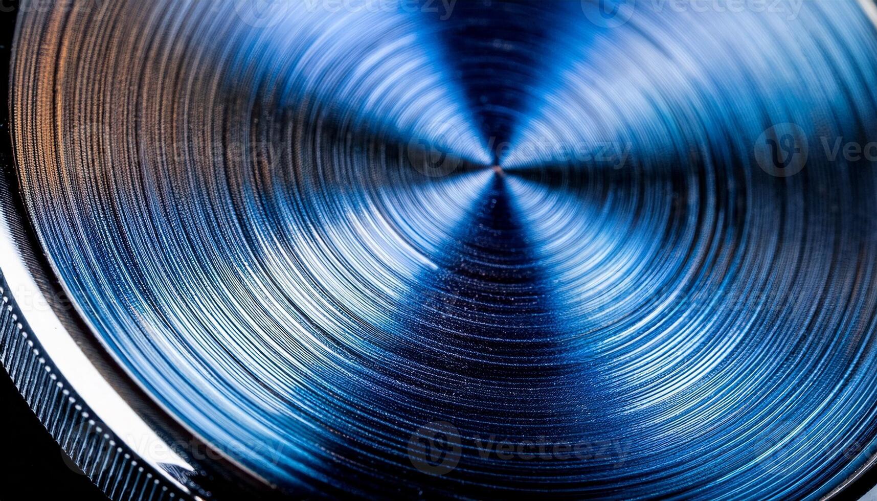 Close-up View of a Metallic Surface With Intricate Circular Patterns Reflecting Light in a Studio Setting photo