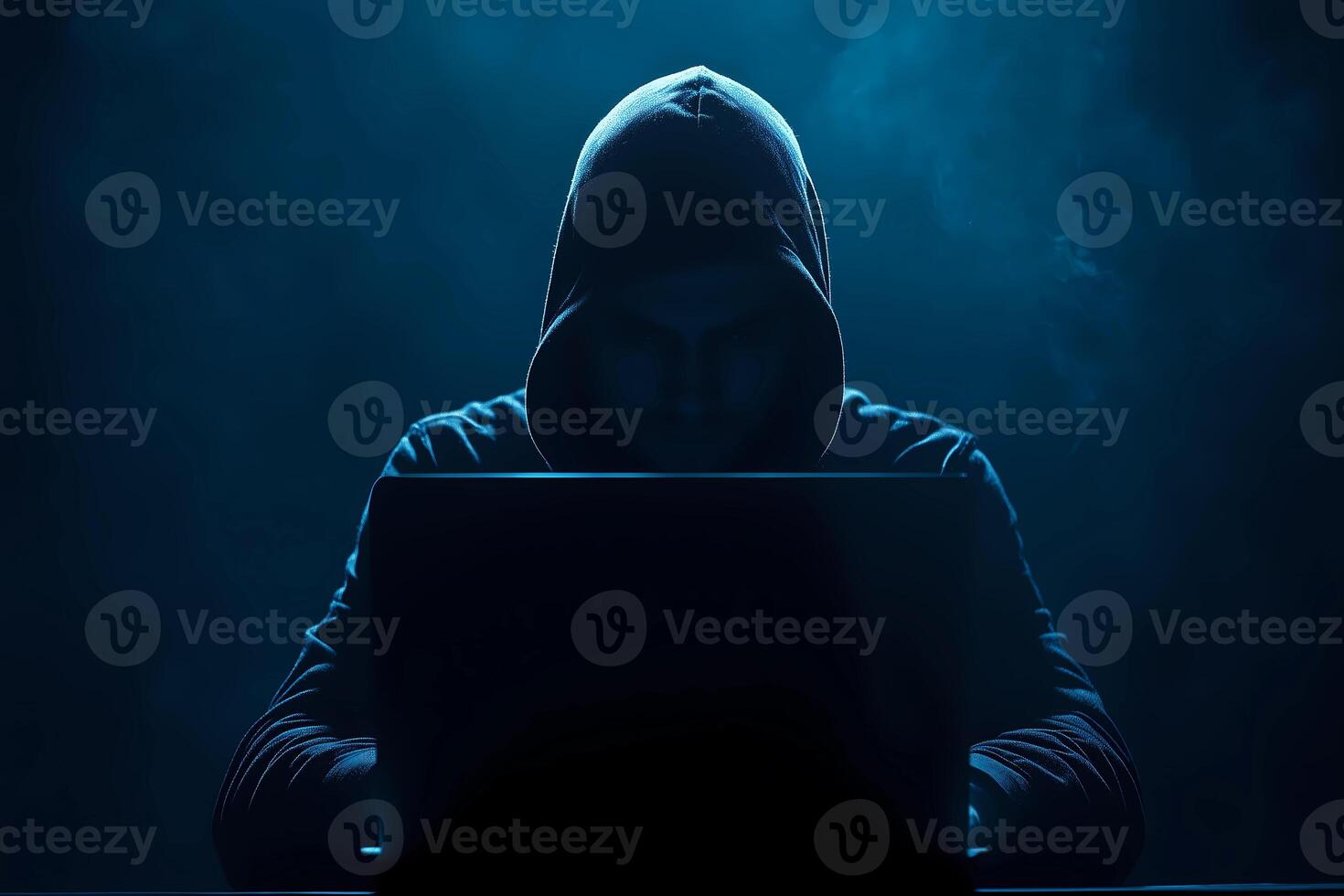Cyber hacker attack concept. Abstract digital hacker man with a laptop. Male criminal, hoodie and ready for coding, cyber-attack and programming photo