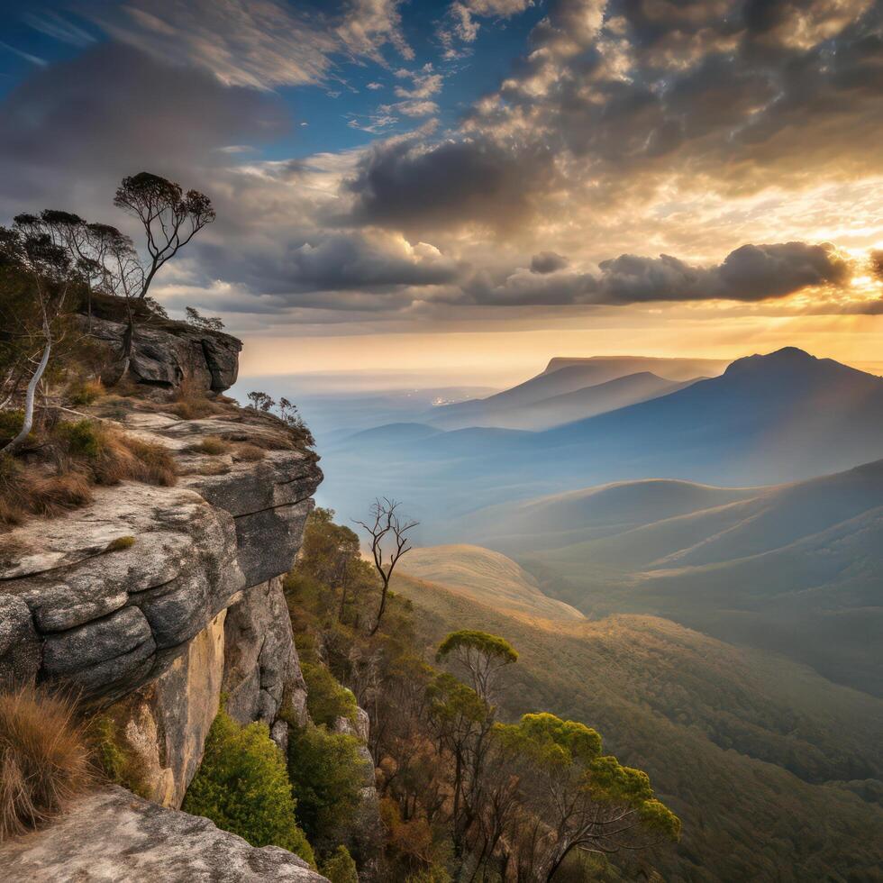 The sun sets over the blue mountains in australia photo
