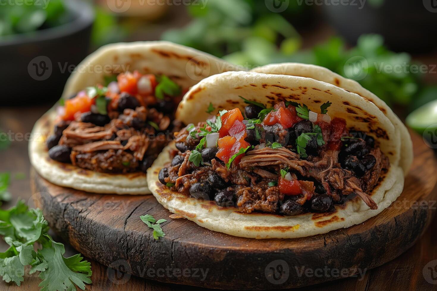 Venezuelan arepas filled with shredded beef, black beans, and cheese, arranged on a rustic wooden plate, with vibrant background details photo