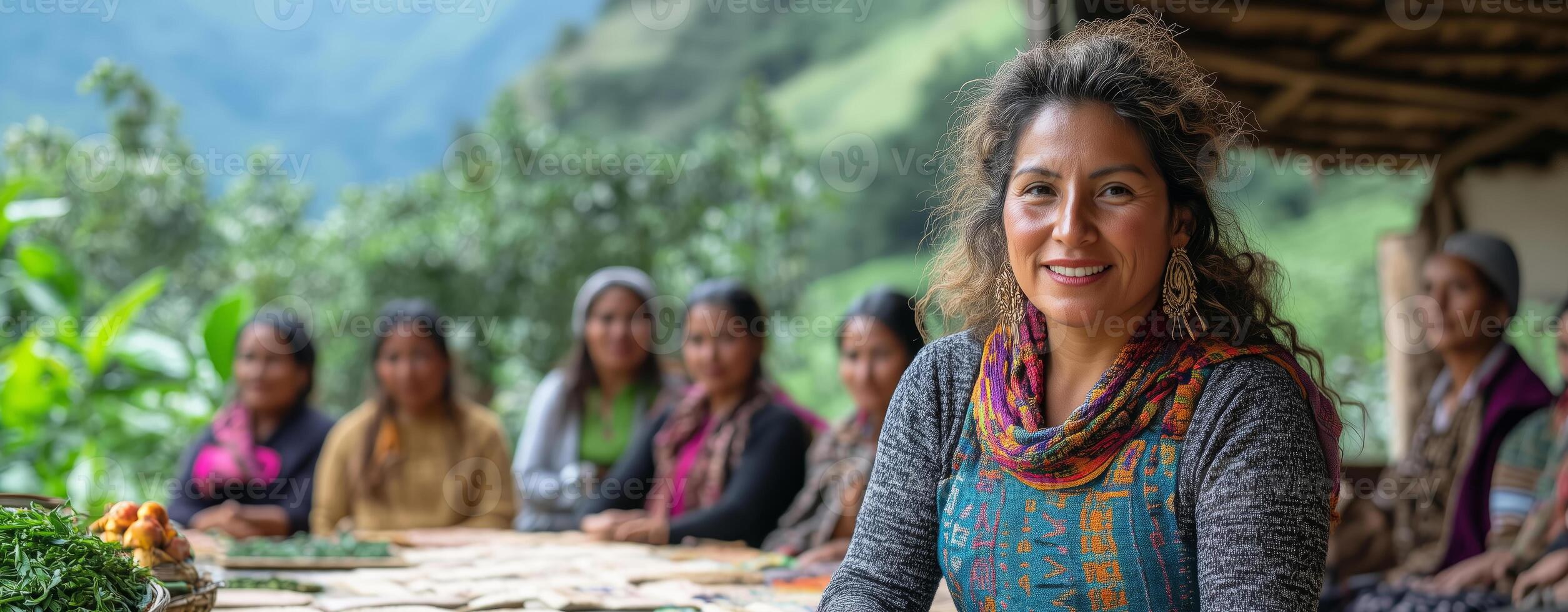 a woman leading a fair trade cooperative meeting outdoors, surrounded by artisans displaying handmade products, with trees and mountains in the background, and room on the right for text photo