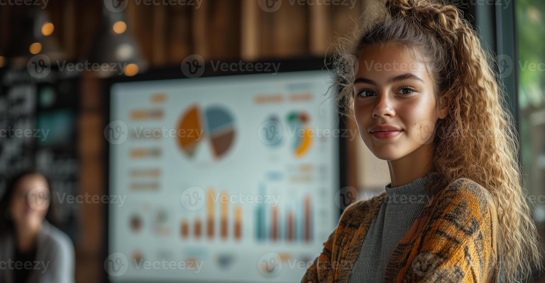 A young entrepreneur presents a creative pitch, showcasing her business ideas with a graph to potential investors photo