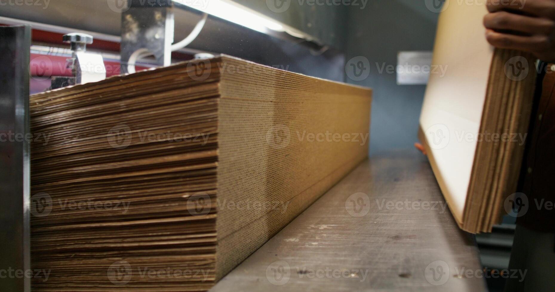 A man is working on a large piece of wood photo