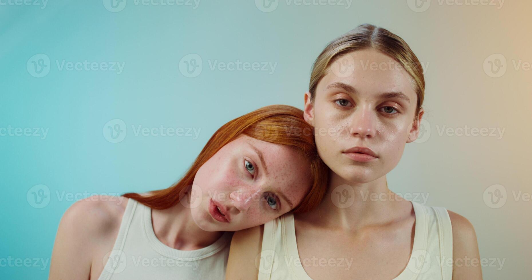 Two women with red hair and blue eyes photo