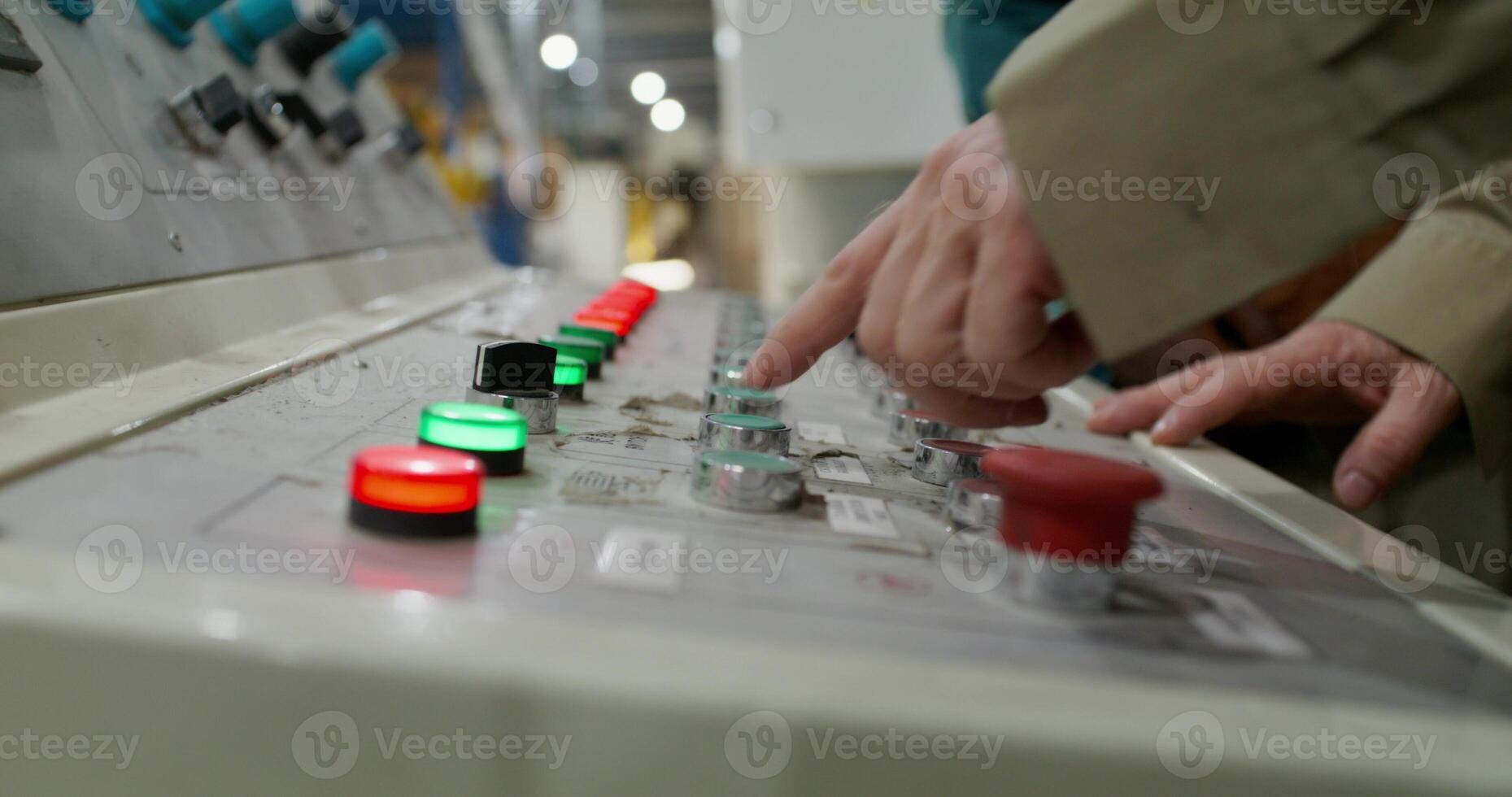 A person is touching a control panel photo