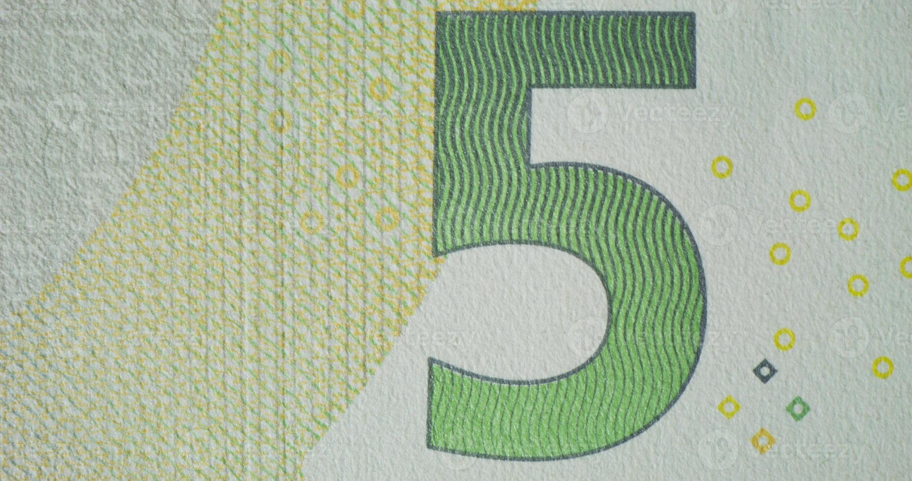 Five euro banknote with the number five on it photo
