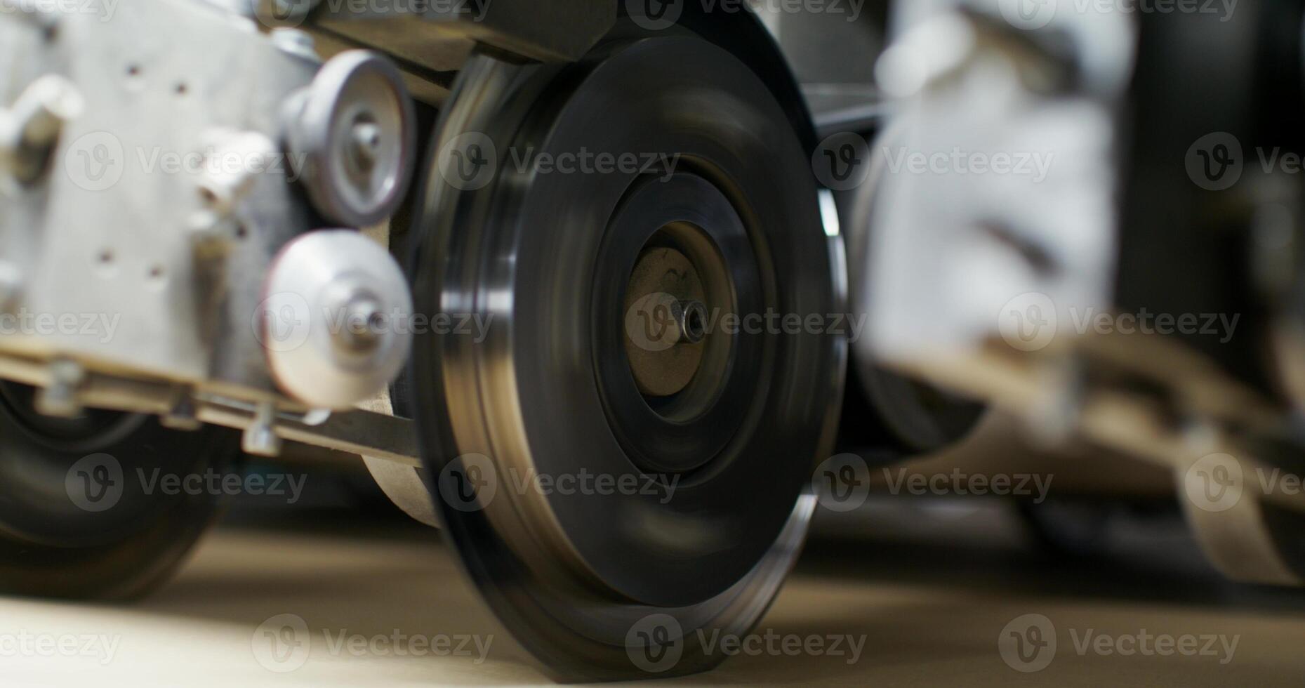 A close up of a machine that is cutting metal photo